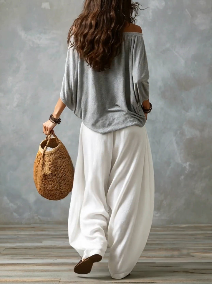 Haut gris à épaules dénudées et pantalon lanternes blanc ample